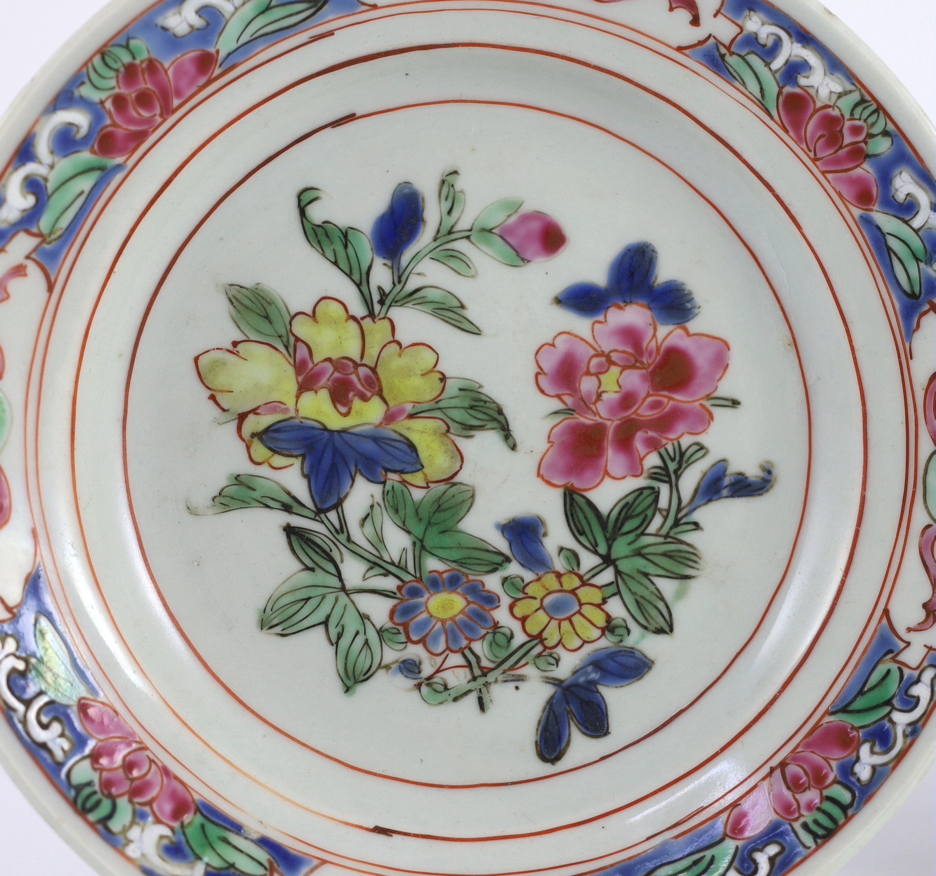A pair of Chinese famille rose fencai small plates, early Yongzheng period, 16 cms diameter, 16cm diameter